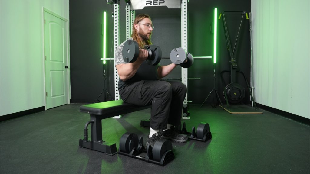 BarBend tester using the Nuobell adjustable dumbbells.