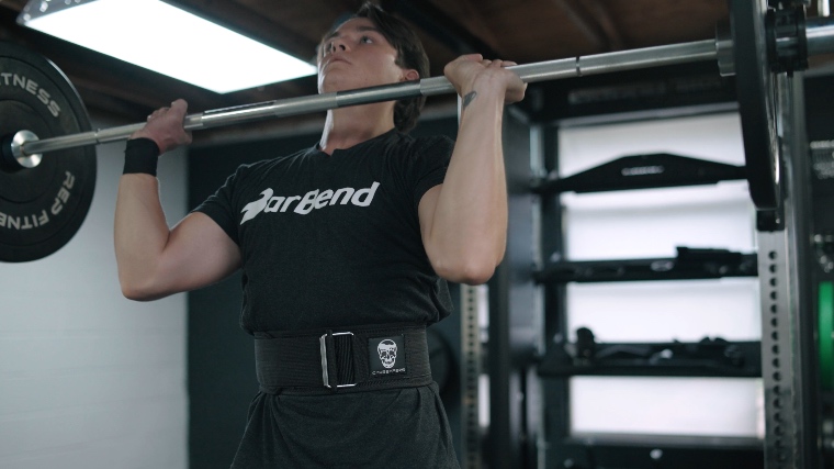 Jake tests a top weightlifting belt at the Barbend garage gym