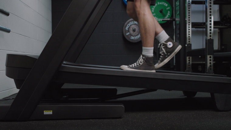 A person using the incline on the Nordictrack Commercial 1750