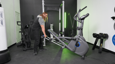 Our tester moving one of the Best Ellipticals for Low Ceilings.