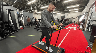 A person on the Urevo Under-Desk Treadmill.